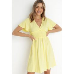 Żółta Sukienka z Wiskozy Gulpari. Żółte sukienki damskie Born2be, l, bez wzorów, z wiskozy, bez kołnierzyka, bez ramiączek, mini, rozkloszowane. Za 74.99 zł.