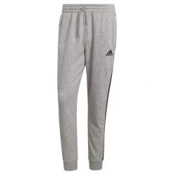 Spodnie męskie adidas Essentials Tapered Cuff 3 Stripes. Czarne buty sportowe męskie Adidas, l, bez wzorów, z bawełny, na fitness i siłownię. Za 206.10 zł.
