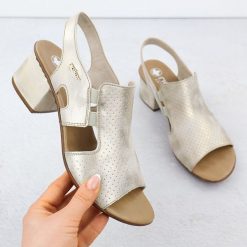 Sandały damskie na obcasie wsuwane złote Rieker 64665-60. Żółte sandały damskie Rieker, bez wzorów, ze skóry ekologicznej, bez obcasa, na obcasie, bez zapięcia. Za 319.00 zł.