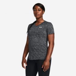Koszulka damska Under Armour Tech™ Twist. Czarne koszulki sportowe damskie Under Armour, xs, bez wzorów, z materiału, bez kołnierzyka. Za 79.99 zł.