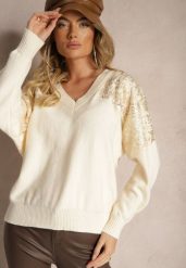 Jasnobeżowy Sweter o Kroju Nietoperza Ozdobiony Cekinami i Cyrkoniami Nevarraea. Brązowe swetry damskie Renee, z aplikacjami, z jeansu, casualowe, bez kołnierzyka, bez ramiączek, bez kaptura. Za 119.99 zł.