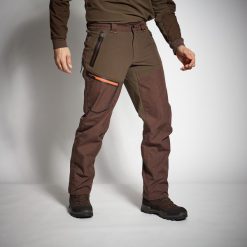 Spodnie myśliwskie Solognac 920 wzmocnione. Brązowe spodnie sportowe męskie SOLOGNAC, s, bez wzorów, outdoorowe. Za 599.99 zł.