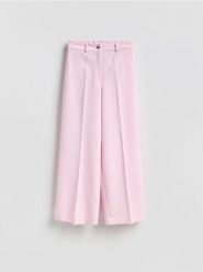 Luźne spodnie - różowy. Czerwone spodnie materiałowe damskie Reserved, l, bez wzorów, z tkaniny. Za 129.99 zł.