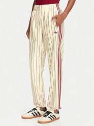 Adidas Spodnie dresowe Pinstripe Firebird Track Ptan KT1851 Kremowy Regular Fit. Białe spodnie dresowe damskie Adidas, l, bez wzorów, z dresówki. Za 399.99 zł.