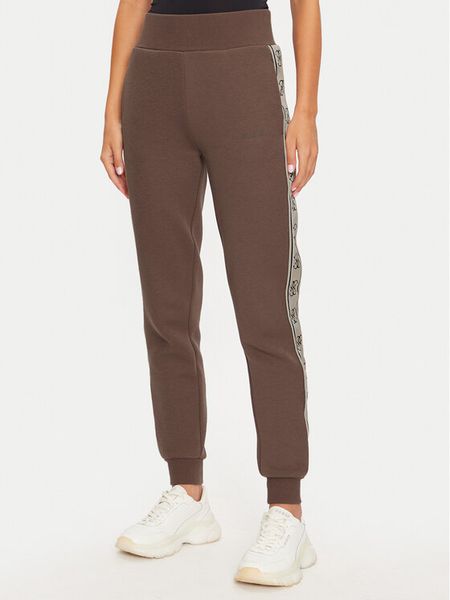 Guess Spodnie dresowe Britney V2YB15 KB3P2 Brązowy Regular Fit. Brązowe spodnie dresowe damskie Guess, xs, z aplikacjami, z dresówki. Za 429.99 zł.