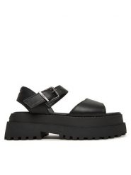 Buffalo Sandały Pluto Jojo 1602267 Czarny. Czarne sandały damskie Buffalo, bez wzorów, ze skóry, bez obcasa, na koturnie, bez zapięcia. Za 209.99 zł.