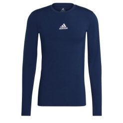Koszulka piłkarska męska adidas Compression Long Sleeve Tee. Niebieskie bluzki z długim rękawem męskie Adidas, m, bez wzorów, bez kołnierzyka, bez ramiączek, do piłki nożnej. Za 99.99 zł.