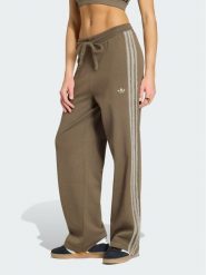 Adidas Spodnie dresowe Firebird KS7362 Brązowy Regular Fit. Brązowe spodnie dresowe damskie Adidas, xs, bez wzorów, z dresówki. Za 314.99 zł.