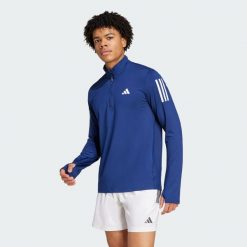 Bluza Own The Run Half-Zip. Niebieskie bluzy męskie Adidas, m, bez wzorów, bez kaptura, do biegania. Za 219.00 zł.
