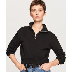 Krótka bluza ze stójką - Czarny. Bluzy damskie marki KALENJI. W wyprzedaży za 34.99 zł.