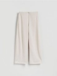 Dzianinowe spodnie z bawełną - beżowy. Brązowe spodnie materiałowe damskie Reserved, l, bez wzorów, z bawełny. Za 99.99 zł.