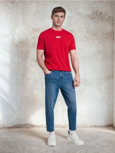 Jeansy carrot z efektem sprania - niebieski. Niebieskie jeansy męskie Sinsay. Za 35.99 zł.