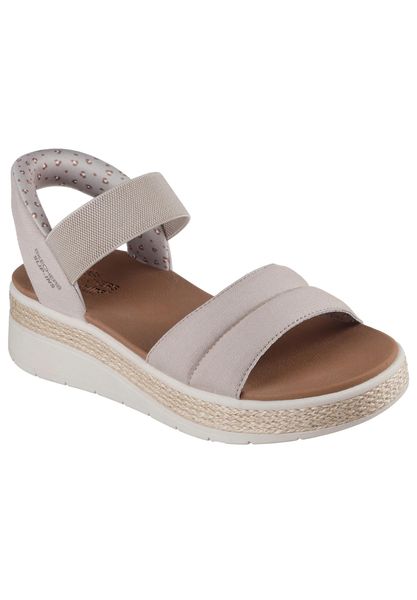 Sandały SKECHERS 114413S Brązowy. Brązowe sandały damskie Skechers, bez wzorów, z materiału, bez obcasa, bez zapięcia. Za 289.99 zł.