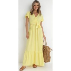 Żółta Sukienka Diomeira. Żółte sukienki damskie Born2be, l, bez wzorów, z tkaniny, eleganckie, bez kołnierzyka, bez ramiączek, maxi, kopertowe. Za 74.99 zł.