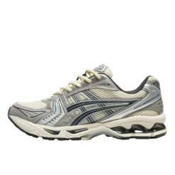 Buty do chodzenia dla dorosłych ASICS Gel-Kayano 14 Oyster White Steeple Grey. Białe obuwie sportowe damskie Asics, bez wzorów, ze skóry, do biegania, asics gel kayano. Za 945.48 zł.