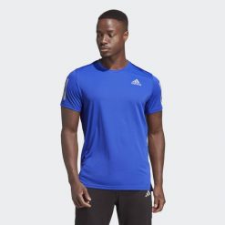 Own the Run Tee. Niebieskie koszulki sportowe męskie Adidas, uniwersalny, bez wzorów, z materiału, bez kołnierzyka, bez ramiączek, do biegania. W wyprzedaży za 129.95 zł.