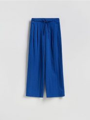 Luźne spodnie z lyocellem - niebieski. Niebieskie spodnie materiałowe damskie Reserved, l, bez wzorów, z lyocellu. Za 139.99 zł.