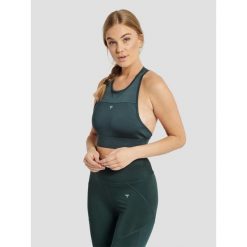 Biustonosz damski Hummel hmlnorma sports. Zielone obuwie sportowe damskie Hummel, bez wzorów, na fitness i siłownię. W wyprzedaży za 137.70 zł.