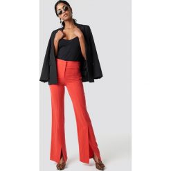 Trendyol Spodnie z rozcięciami z przodu - Red. Czerwone spodnie materiałowe damskie marki Trendyol, z haftami, z lyocellu. Za 121.95 zł.