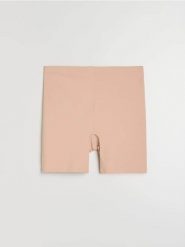 Szorty modelujące z silikonową taśmą na nogawkach - kremowy. Białe szorty damskie Sinsay, l, bez wzorów. Za 25.99 zł.