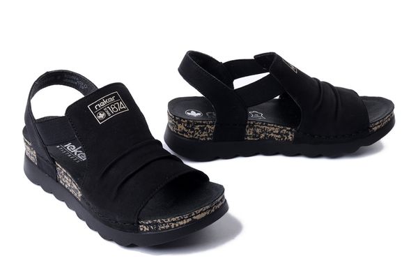RIEKER 64463-01 black, sandały damskie. Czarne sandały damskie Rieker, bez wzorów, bez obcasa, na koturnie, bez zapięcia. Za 319.90 zł.