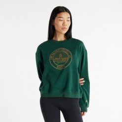 Bluza damska New Balance WT43553NWG – zielona. Zielone bluzy damskie New Balance, l, bez wzorów, z bawełny, bez kaptura. Za 199.99 zł.