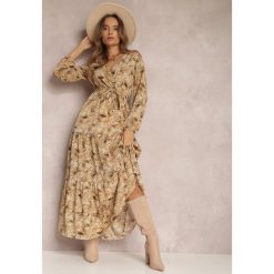 Beżowa Sukienka Kopertowa Maxi Fisa. Brązowe sukienki damskie Renee, l, z aplikacjami, z tkaniny, boho, bez kołnierzyka, bez ramiączek, maxi, kopertowe. Za 99.99 zł.