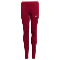 Legginsy dziewczęce adidas Essentials. Czerwone legginsy dla dziewczynek Adidas, bez wzorów, z bawełny. Za 62.99 zł.