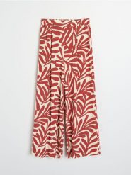 Wiskozowe spodnie wide leg z abstrakcyjnym wzorem - żółty. Żółte spodnie materiałowe damskie Sinsay, l, bez wzorów, z wiskozy. Za 39.99 zł.