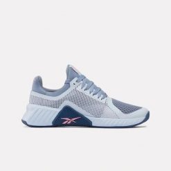 Damskie buty treningowe Reebok FLIP CHARGE 100272254 jasnoniebieskie. Niebieskie obuwie sportowe damskie Reebok, bez wzorów, na fitness i siłownię. Za 303.00 zł.