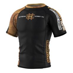 Koszulka Męska Rashguard MMA na Siłownię EXTREME HOBBY GOLDEN WARRIOR. Czarne koszulki sportowe męskie EXTREME HOBBY, m, bez wzorów, z bawełny, bez kołnierzyka, bez ramiączek, do biegania. Za 199.00 zł.