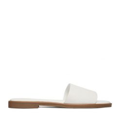 Klapki JENNY. Białe klapki damskie Jenny, bez wzorów, bez obcasa. Za 69.99 zł.