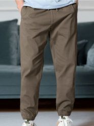 Spodnie jogger - beżowy. Brązowe spodnie materiałowe męskie Sinsay, bez wzorów. Za 49.99 zł.