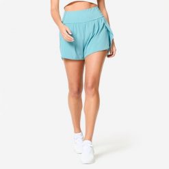 Spodenki fitness cardio damskie Domyos 2w1. Niebieskie szorty sportowe damskie Decathlon, s, bez wzorów, z materiału, sportowe, na fitness i siłownię. W wyprzedaży za 54.99 zł.