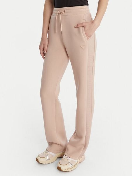 Guess Spodnie dresowe V3RB21 K7UW2 Beżowy Regular Fit. Brązowe spodnie dresowe damskie Guess, l, z aplikacjami, z dresówki. Za 399.99 zł.