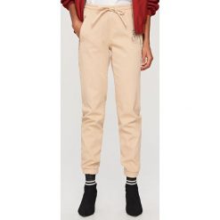 Spodnie jogger - Beżowy. Spodenki niemowlęce marki Reserved. Za 129.99 zł.
