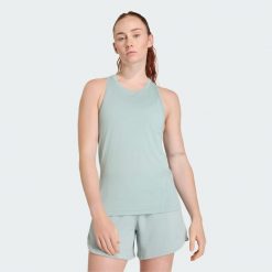 Koszulka treningowa bez rękawów Designed for Training. Zielone koszulki sportowe damskie Adidas, bez wzorów, z materiału, bez kołnierzyka, bez ramiączek, na fitness i siłownię. Za 149.00 zł.