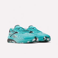 Damskie buty treningowe Reebok NANO X5 EDGE 100272190 turkusowe. Niebieskie obuwie sportowe damskie Reebok, bez wzorów, na fitness i siłownię. Za 539.00 zł.