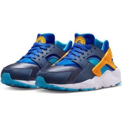 Buty Nike Air Huarache Run 654275 422 niebieskie. Niebieskie obuwie sportowe damskie bez wzorów, z materiału. Za 491.47 zł.