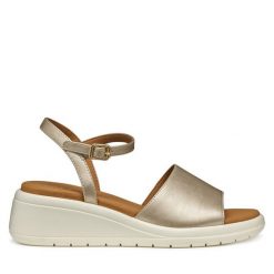 Sandały Geox. Żółte sandały damskie Geox, bez wzorów, bez obcasa, na koturnie, bez zapięcia. Za 259.99 zł.
