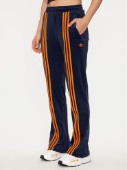 Adidas Spodnie dresowe Velour JN8290 Granatowy Regular Fit. Niebieskie spodnie dresowe damskie Adidas, xl, bez wzorów, z dresówki. Za 299.99 zł.