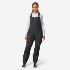 Spodnie żeglarskie damskie Decathlon 500 na szelkach. Czarne spodnie materiałowe damskie Decathlon, m, bez wzorów, z polaru. Za 489.99 zł.