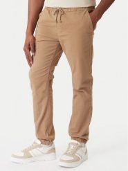 Tommy Jeans Joggery DM0DM23102 Brązowy Regular Fit. Brązowe spodnie materiałowe męskie Tommy Jeans, l, bez wzorów, z bawełny. Za 369.99 zł.