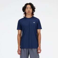 Koszulka męska New Balance MT41222NNY – granatowa. Niebieskie koszulki sportowe męskie New Balance, m, bez wzorów, z materiału, bez kołnierzyka, bez ramiączek, do biegania. Za 149.99 zł.