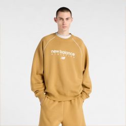 Bluza męska New Balance MT61U4JOABG – pomarańczowa. Brązowe bluzy męskie New Balance, m, bez wzorów, z bawełny, bez kaptura. Za 279.99 zł.