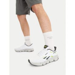 Buty do biegania Reebok. Białe buty sportowe męskie Reebok, bez zapięcia, do biegania. Za 329.99 zł.