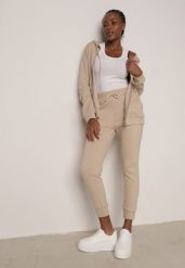 Beżowy Komplet Dresowy Zasuwana Bluza z Kapturem i Spodnie Typu Jogger Nedisare. Brązowe spodnie dresowe damskie Born2be, l, bez wzorów, z dresówki. Za 99.99 zł.
