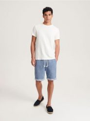 Szorty regular fit - granatowy. Niebieskie szorty męskie Reserved, l, bez wzorów, z bawełny. W wyprzedaży za 55.99 zł.
