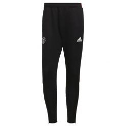 Spodnie treningowe Manchester United Tiro 2021/22. Czarne spodnie sportowe męskie Adidas, m, bez wzorów, z materiału, do piłki nożnej. Za 183.45 zł.