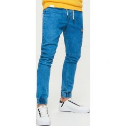 Jeansy SLIM JOGGER - Niebieski. Jeansy męskie marki Cropp. Za 129.99 zł.